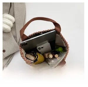 Spacious interior of brown corduroy tote bag showing capacity for tablets and daily items