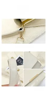 Detailed view of the creamy white single shoulder bag featuring gold hardware and lychee texture