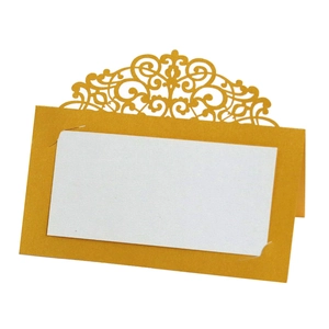 Elegant gold laser-cut lace wedding place card with white name area and floral pattern