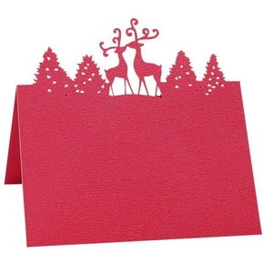 Laser-cut red Christmas table tent card with reindeer and pine tree silhouettes