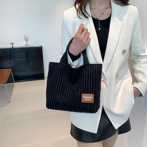 Minimalist black corduroy tote bag with fashion leather tag for urban casual style