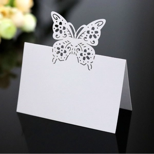 Elegant laser-cut butterfly place cards in white, perfect for wedding table decor