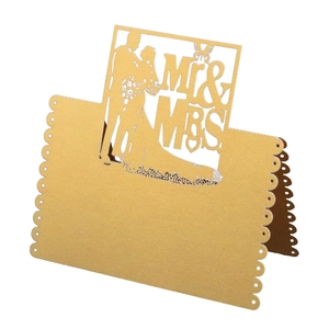 Elegant laser cut 3D butterfly gold wedding place card featuring Mr and Mrs silhouette