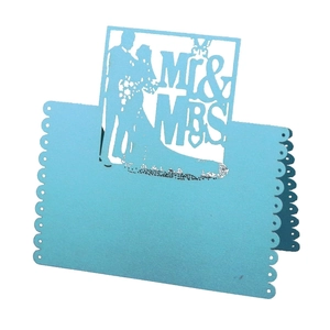 Elegant laser-cut light blue place card with Mr & Mrs silhouette and heart patterns
