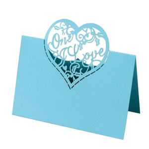 Laser cut light blue heart place card with One Love text and vine patterns for wedding table