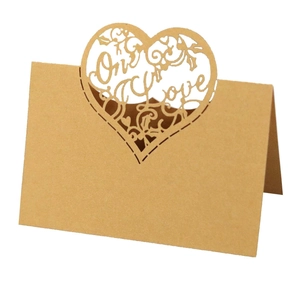 Kraft paper place card with laser-cut heart and One Love text for wedding decor