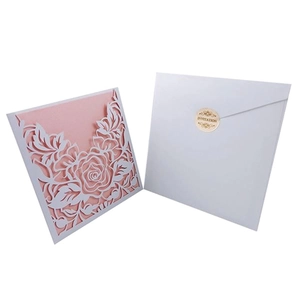 European laser-cut rose invitation set with pink inner card and white envelope