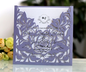 Laser-cut lavender floral wedding invitation with elegant white rose pattern and MJ logo