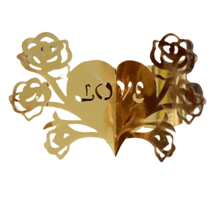 Golden laser-cut napkin ring featuring rose floral patterns and LOVE heart design