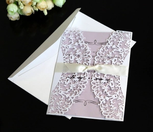 Elegant white laser cut wedding invitation with lace pattern and silk ribbon bow set
