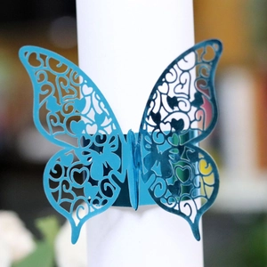 Elegant laser-cut butterfly napkin ring in pearlescent lake blue for wedding decor