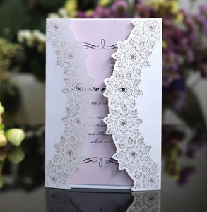 Elegant white lace laser-cut wedding invitation card with pink insert and floral design