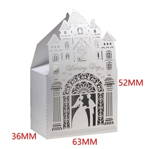 Laser-cut white wedding favor box with castle design and bride and groom silhouettes