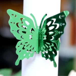 Portatovagliolo a farfalla verde con motivo traforato al laser per decoro tavola