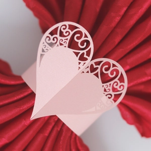 Pink heart laser-cut paper napkin ring for elegant wedding and hotel table decor