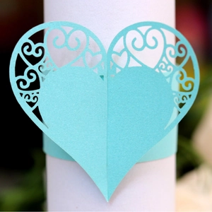 Laser-cut heart-shaped paper napkin ring in sky blue with elegant floral hollow patterns