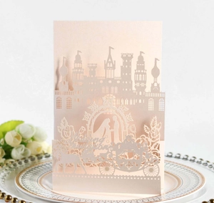 Elegant 3D laser cut wedding invitation card featuring a romantic castle and horse carriage