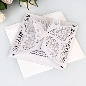 Laser cut butterfly wedding invitation set with white pearlescent paper and envelope