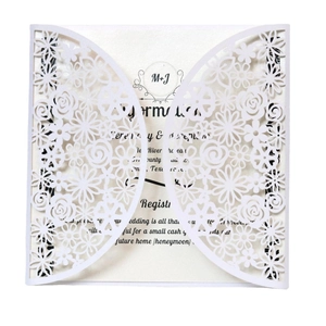 Elegant white laser-cut floral wedding invitation card with intricate hollow pattern