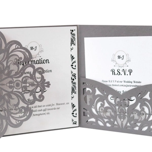 Elegant silver laser-cut wedding invitation set with floral cover and RSVP card