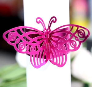 Magenta butterfly napkin ring with laser-cut hollow design for elegant table decor