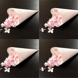 White laser cut confetti cones with pink petals for wedding ceremony celebrations