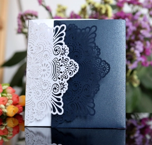 Macro detail of laser-cut mandala pattern on champagne gold luxury wedding invitations