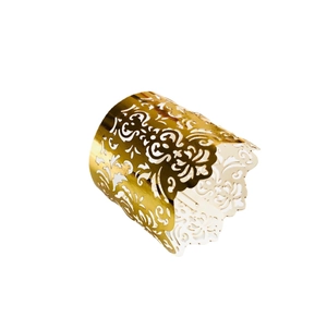 Golden laser-cut hollow tea light candle wrap with intricate floral lace pattern