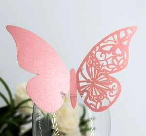 Elegant pink laser-cut butterfly card decoration for wine glass and wedding table settings