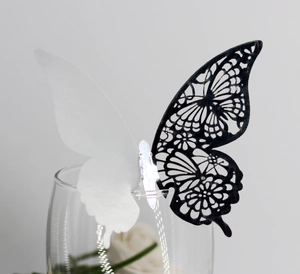Detail of 3D butterfly glass card with laser-cut floral patterns and silver mirror effect