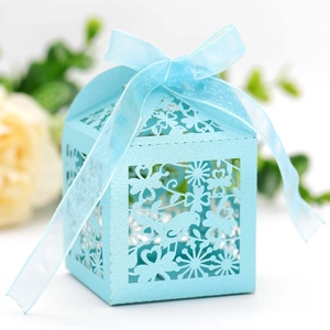 Laser-cut light blue candy gift box with bird patterns and a delicate chiffon ribbon bow