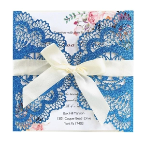 Elegant laser cut navy blue glitter wedding invitation with white ribbon and floral insert