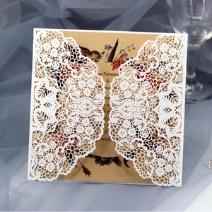 Elegant laser cut lace wedding invitation with vintage floral kraft paper insert