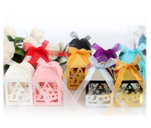 Laser cut Christmas candy gift boxes with snowflake and tree patterns in multiple colors