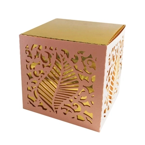 Pink and gold laser cut vine leaf wedding favor box with intricate hollow design