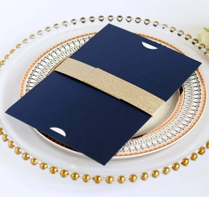 Navy blue pearlescent paper invitation with golden glitter belly band for weddings