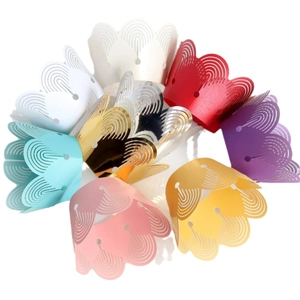 Laser-cut cupcake wrappers in various pearlescent colors with elegant hollowed-out lace design