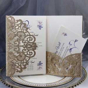 Elegant gold laser cut wedding invitation set with glitter cover and floral inner cards