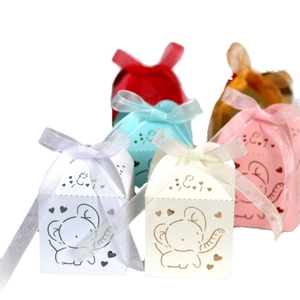 Laser-cut elephant candy boxes with ribbon bows for weddings and baby shower parties
