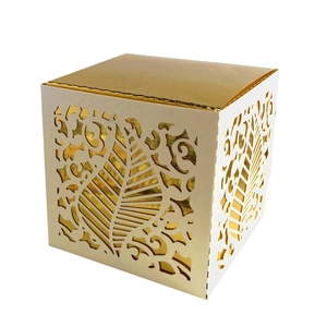 Elegant white laser-cut wedding candy box with golden vine and leaf hollow pattern
