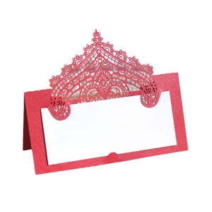 Red laser-cut wedding place card with crown lace pattern and white writing area on white background