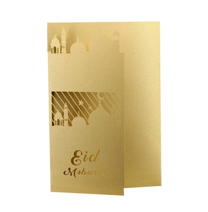 Golden laser-cut Eid Mubarak invitation card featuring a mosque, moon, and star design