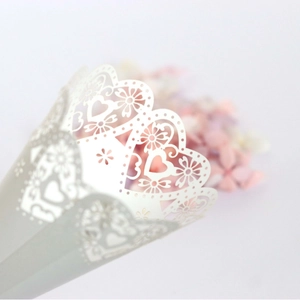 White laser-cut heart pattern paper wedding petal cones for romantic celebration decor
