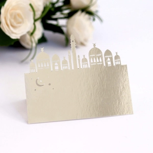 Champagne gold laser-cut table card with crescent moon and mosque silhouette design