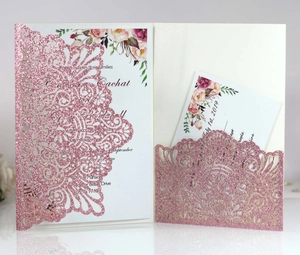 Elegant laser cut wedding invitation with pink glitter finish and floral interior card