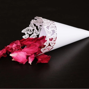 White laser-cut butterfly confetti cone with deep red rose petals for wedding decor