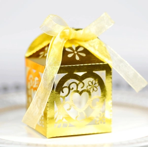 Elegant gold laser-cut heart candy box with silk ribbon for wedding and engagement parties