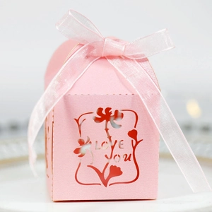 Pink laser-cut candy box with Love You text and pink ribbon for wedding favors