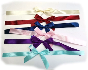 Close-up of colorful satin ribbon bows in six different colors for gift wrapping decor