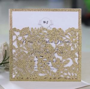 Elegant laser cut floral wedding invitation in gold glitter with printed white inner card